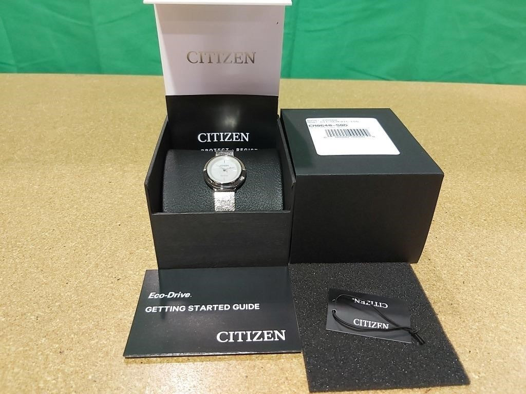 W35 Citizen Eco-Drive round stainless steel case and mesh bracelet, white mother-of-pearl dial, 1 diamond on case, moon glazed SC, 32mm case, WR50, sliding clasp. LADIES